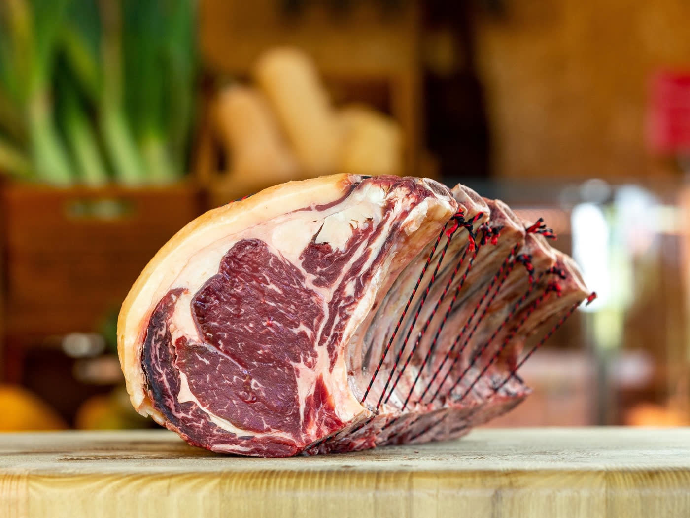 Dry-aged standing rib on a butcher block